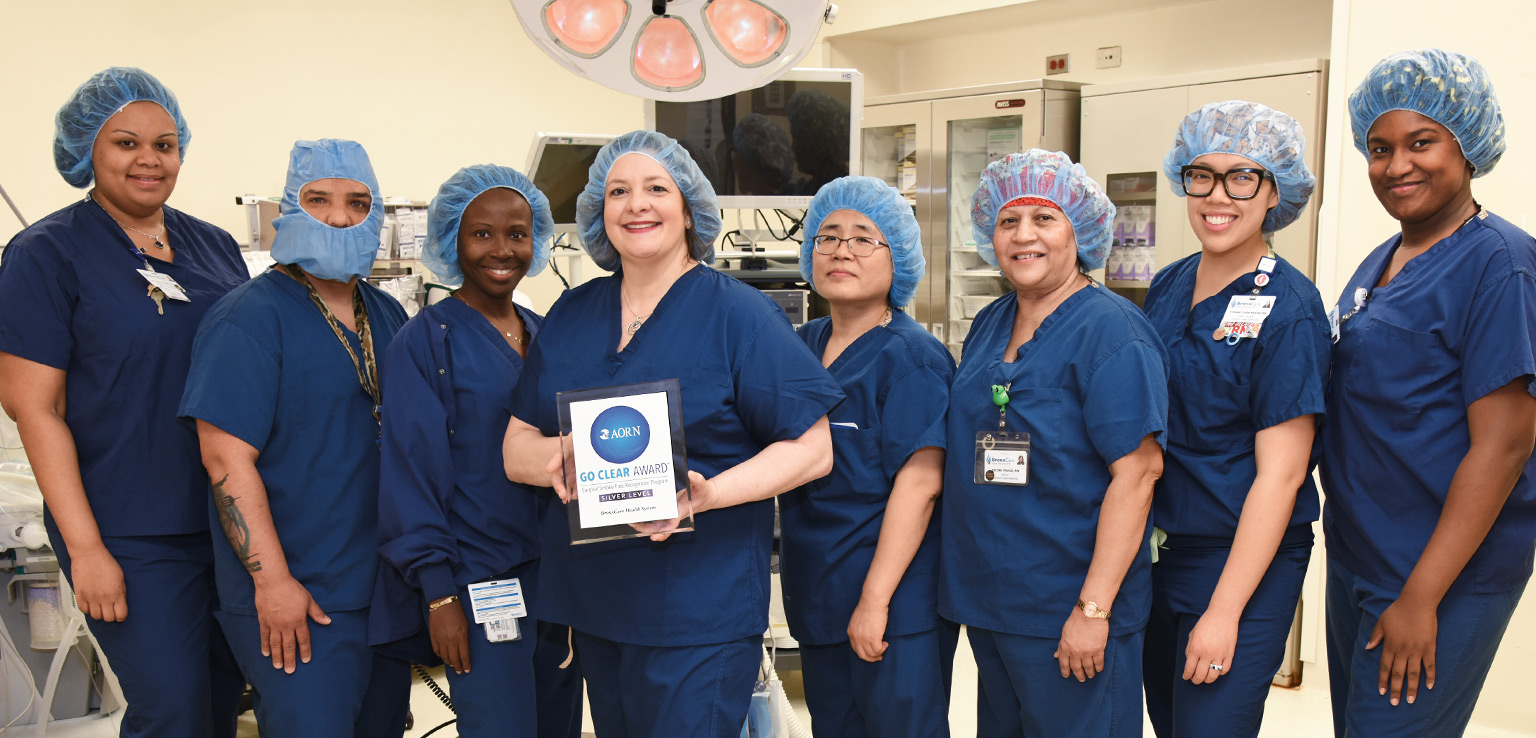 Teresa Pedretti-Ramos, RN, Director, Perioperative Services, with OR Team.