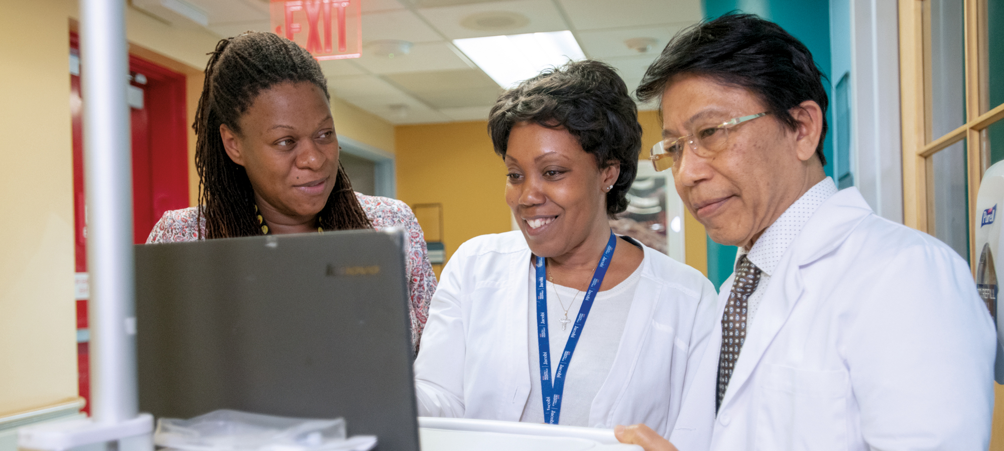 (L to R): Camieca Fougah, Pediatric Social Worker, Gail Posey, RN, and Dr. Lin Lin Kin,
Chief Hospitalist, reviewing patient information.