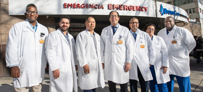 Dr. Robert Favelukes, Chairman, Emergency Medicine (center), and ER team.