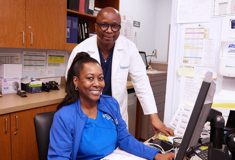 Dr. Andrew Onyejiuwa, Clinical Director, Oral Surgery (right), and Cindy Greaves, RN.