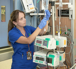 Nadiya Bubniv, RN, Intensive Care Unit, preparing IV solution.